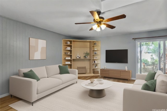 95-100 Moenamanu St Unit 458, Mililani, HI 96789 - living area featuring wood finished floors, ceiling fan, baseboards, and wooden walls