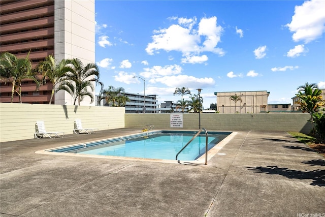 46-270 Kahuhipa St Unit A419, Kaneohe, HI 96744 - community pool with a patio area and a fenced backyard