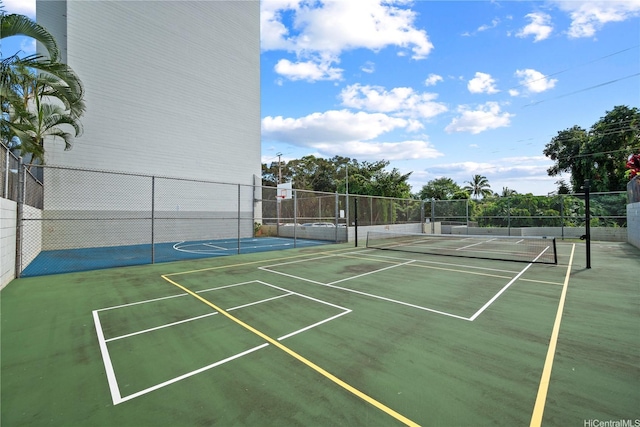 46-270 Kahuhipa St Unit A419, Kaneohe, HI 96744 - view of tennis court featuring community basketball court and fence