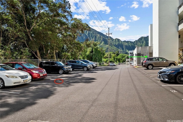 46-270 Kahuhipa St Unit A419, Kaneohe, HI 96744 - uncovered parking lot featuring a mountain view