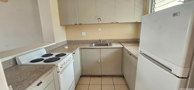 kitchen featuring light tile patterned floors, light countertops, a sink, and white appliances