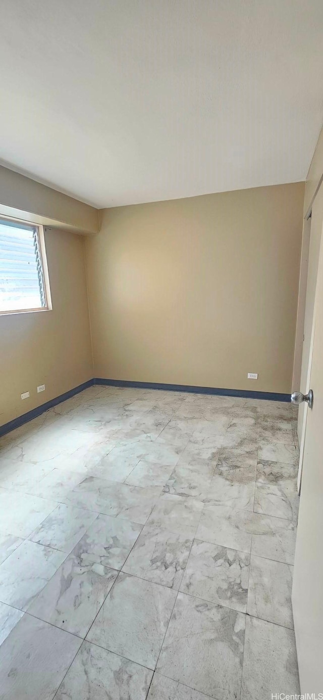 empty room with baseboards