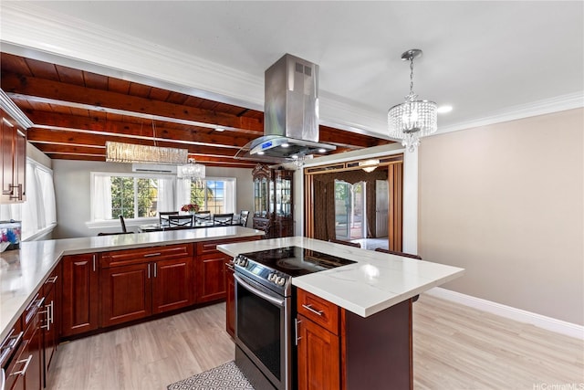 kitchen featuring stainless steel electric range oven, an inviting chandelier, light wood-style floors, dark brown cabinets, and island exhaust hood