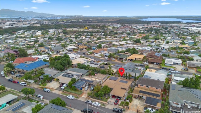 drone / aerial view featuring a residential view and a water and mountain view