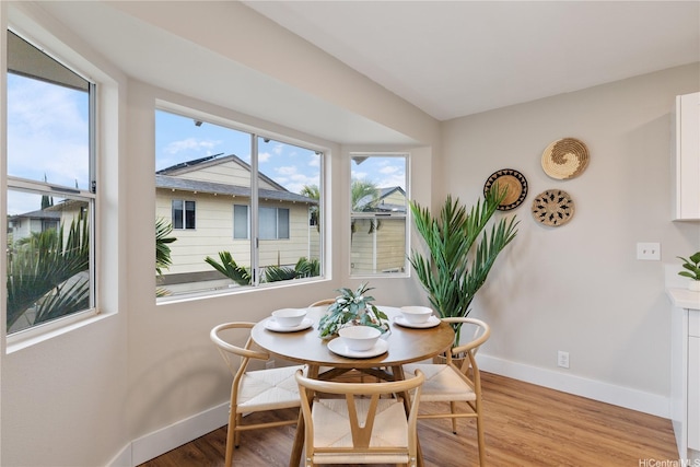 91-1860 Luahoana St Unit 114, Ewa Beach, HI 96706 - dining area featuring baseboards and light wood-style flooring