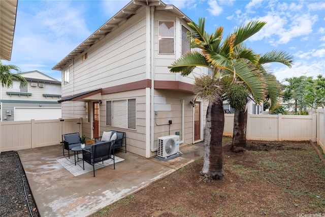 91-1860 Luahoana St Unit 114, Ewa Beach, HI 96706 - back of property featuring a cooling unit, a patio, and a fenced backyard