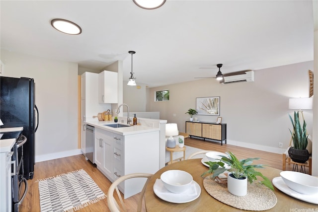 91-1860 Luahoana St Unit 114, Ewa Beach, HI 96706 - dining space with a wall unit AC, light wood-type flooring, a ceiling fan, and baseboards