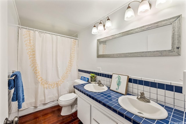 363 Ilimalia Loop, Kailua, HI 96734 - bathroom featuring wood finished floors, toilet, double vanity, and shower / bathtub combination with curtain