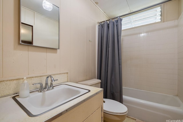 bathroom featuring shower / bathtub combination with curtain, vanity, and toilet