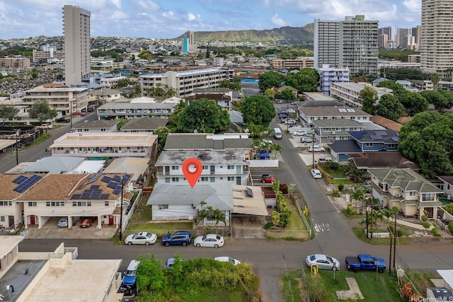 drone / aerial view featuring a mountain view and a view of city