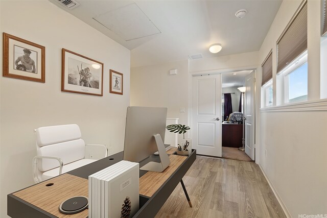 office area with visible vents and light wood finished floors