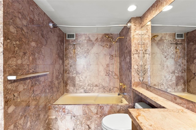 581 Kamoku St Unit Ph4, Honolulu, HI 96826 - full bath featuring tiled shower / bath, toilet, vanity, tile walls, and recessed lighting