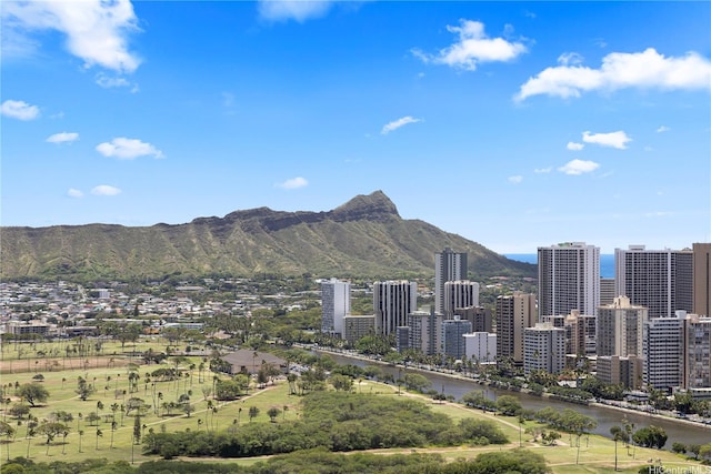mountain view with a water view and a city view