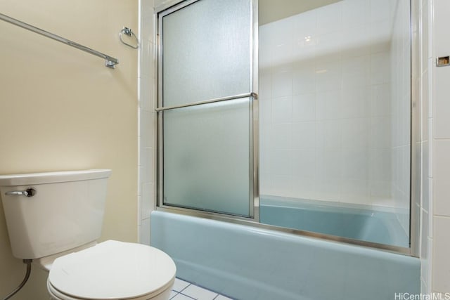1600 Ala Moana Blvd Unit 1406, Honolulu, HI 96815 - bathroom featuring tile patterned flooring, enclosed tub / shower combo, and toilet