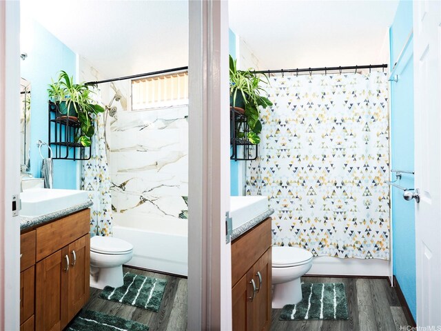 95-273 Waikalani Dr Unit D501, Mililani, HI 96789 - full bathroom with toilet, vanity, shower / tub combo with curtain, and wood finished floors