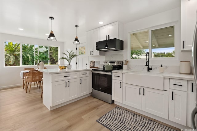 45-127 Waikapoki Rd Unit D, Kaneohe, HI 96744 - kitchen featuring electric stove, a sink, plenty of natural light, a peninsula, and recessed lighting