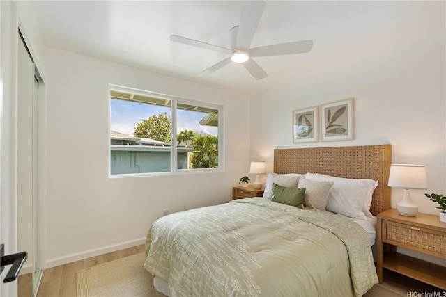 45-127 Waikapoki Rd Unit D, Kaneohe, HI 96744 - bedroom with wood finished floors, baseboards, ceiling fan, and a closet
