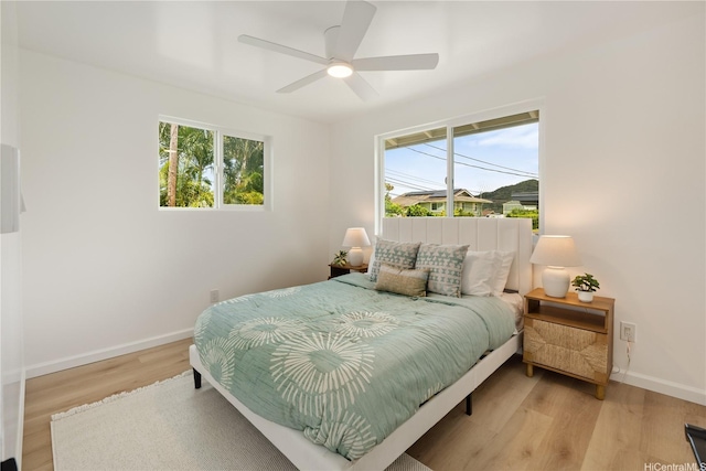 45-127 Waikapoki Rd Unit D, Kaneohe, HI 96744 - bedroom featuring baseboards, light wood-style flooring, and ceiling fan