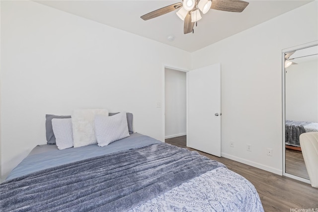 95-781 Wikao St Unit A101, Mililani, HI 96789 - bedroom featuring ceiling fan, wood finished floors, and baseboards