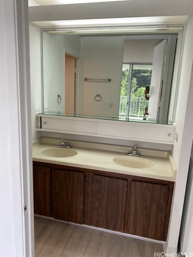 98-410 Koauka Loop Unit 4B, Aiea, HI 96701 - bathroom with a sink, double vanity, and wood finished floors