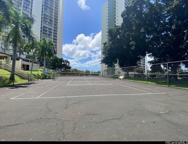 98-410 Koauka Loop Unit 4B, Aiea, HI 96701 - uncovered parking lot featuring fence and a tennis court