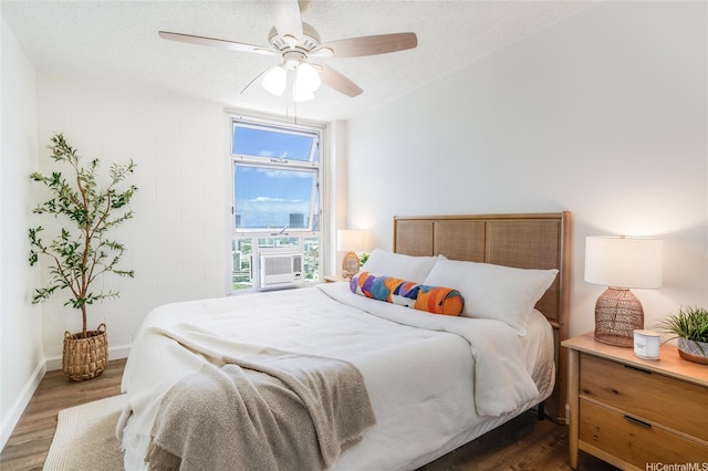 1031 Maunaihi Pl Unit 802, Honolulu, HI 96822 - bedroom with wood finished floors, cooling unit, ceiling fan, and baseboards