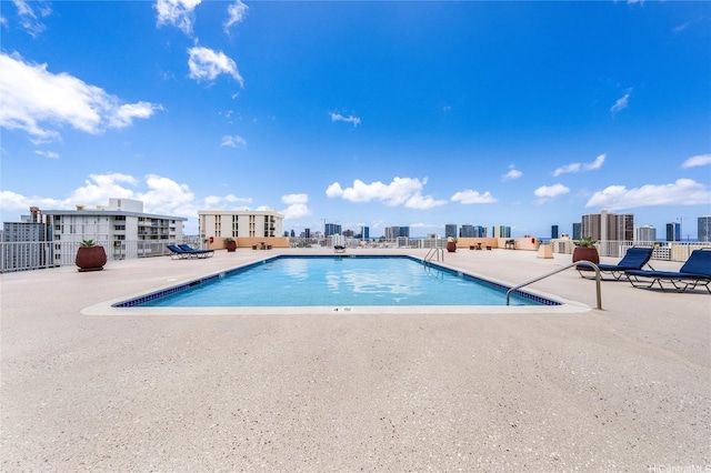 1031 Maunaihi Pl Unit 802, Honolulu, HI 96822 - community pool featuring a patio area and a city view