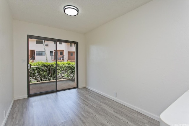 98-376 Kaonohi St Unit 3, Aiea, HI 96701 - spare room with baseboards and wood finished floors