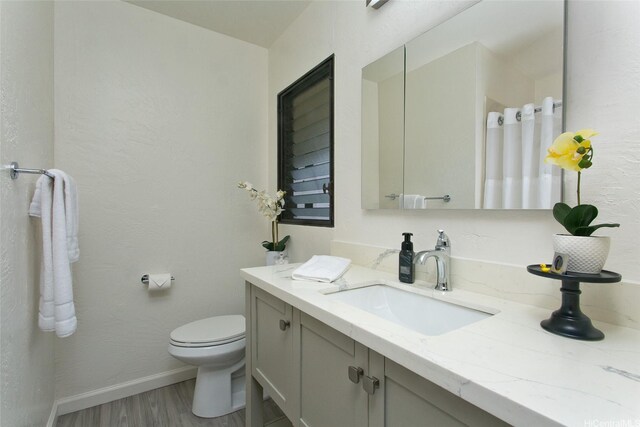 98-376 Kaonohi St Unit 3, Aiea, HI 96701 - bathroom with vanity, wood finished floors, curtained shower, toilet, and baseboards