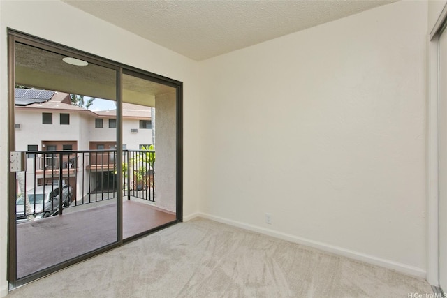 98-376 Kaonohi St Unit 3, Aiea, HI 96701 - spare room with carpet floors, baseboards, and a textured ceiling