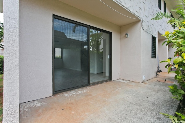 98-376 Kaonohi St Unit 3, Aiea, HI 96701 - doorway to property with stucco siding and a patio area