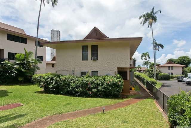 98-376 Kaonohi St Unit 3, Aiea, HI 96701 - view of side of property with fence, stucco siding, a yard, and a chimney