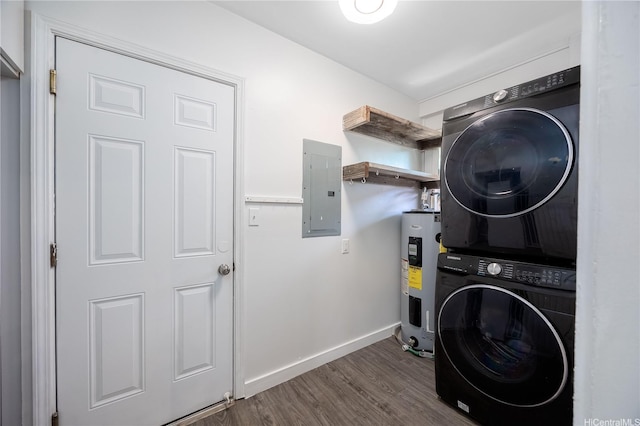 clothes washing area featuring laundry area, electric panel, stacked washer and dryer, dark wood-style floors, and water heater
