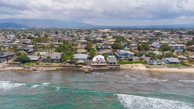 bird's eye view featuring a beach view, a residential view, and a water and mountain view