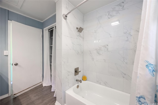 full bath featuring shower / bath combo with shower curtain and wood finished floors