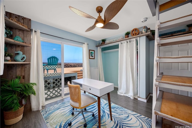 office space with ceiling fan and wood finished floors