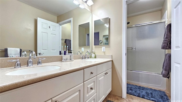 92-1145 Panana St Unit 1608, Kapolei, HI 96707 - full bathroom featuring a sink, shower / bath combination with glass door, tile patterned floors, and double vanity