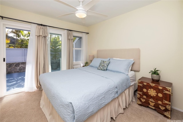 44-1303 Kou Pl Unit 1103, Kaneohe, HI 96744 - bedroom featuring access to outside, baseboards, light carpet, and ceiling fan