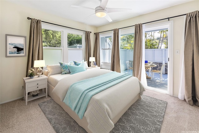 44-1303 Kou Pl Unit 1103, Kaneohe, HI 96744 - carpeted bedroom with baseboards, multiple windows, a ceiling fan, and access to exterior