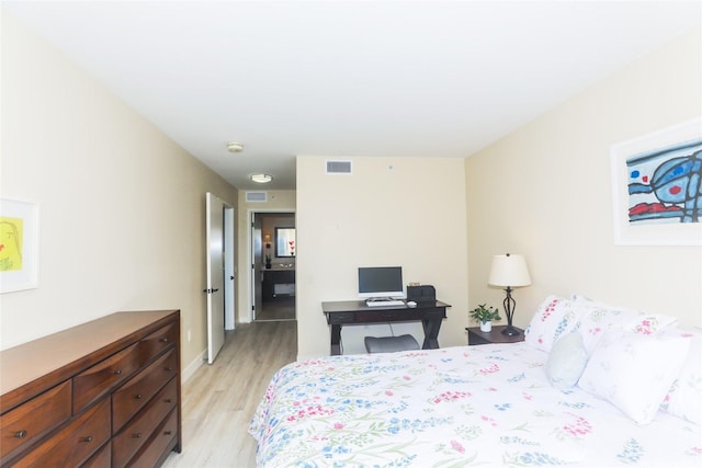 1551 Ala Wai Blvd Unit 703, Honolulu, HI 96815 - bedroom featuring visible vents, light wood finished floors, and baseboards