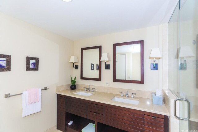1551 Ala Wai Blvd Unit 703, Honolulu, HI 96815 - full bathroom with a sink, a shower stall, and double vanity