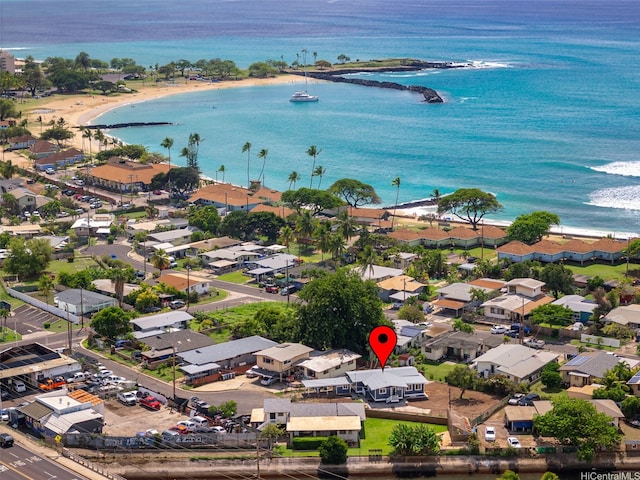 aerial view featuring a water view, a residential view, and a view of the beach