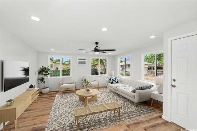 living room featuring a healthy amount of sunlight, ceiling fan, and recessed lighting