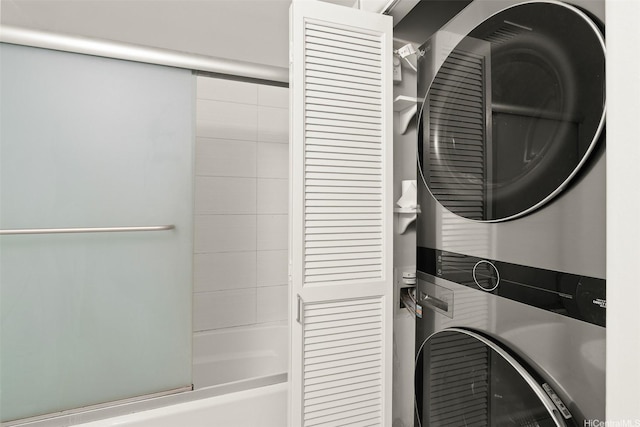laundry area with stacked washing maching and dryer and laundry area