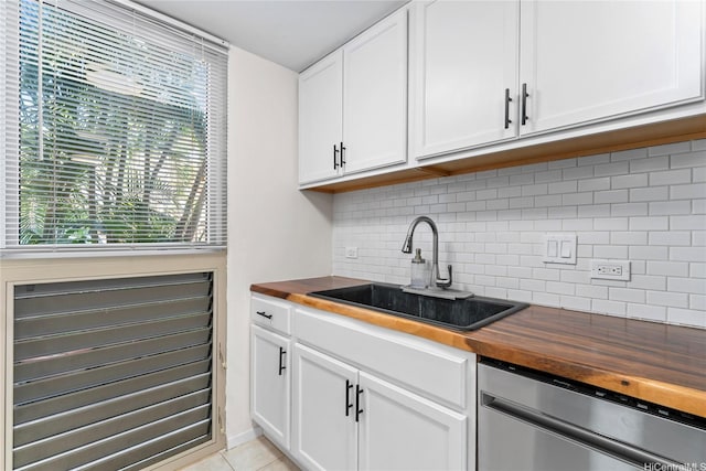 68-090 Au St Unit E102, Waialua, HI 96791 - kitchen featuring stainless steel dishwasher, a sink, decorative backsplash, and wooden counters