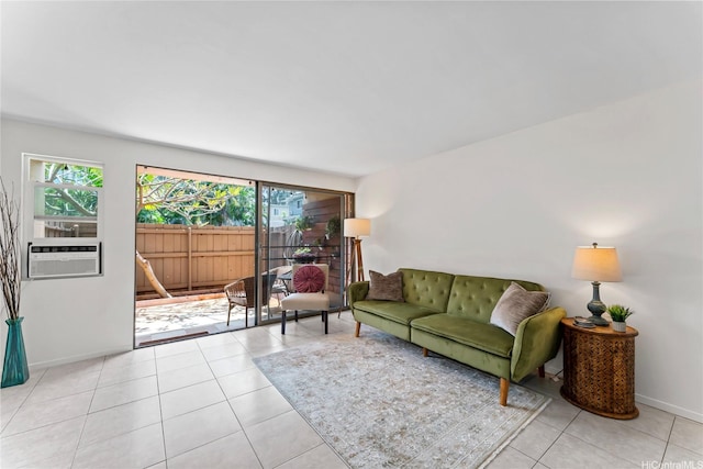 68-090 Au St Unit E102, Waialua, HI 96791 - living room featuring a healthy amount of sunlight, baseboards, cooling unit, and light tile patterned flooring