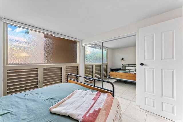68-090 Au St Unit E102, Waialua, HI 96791 - tiled bedroom with a closet