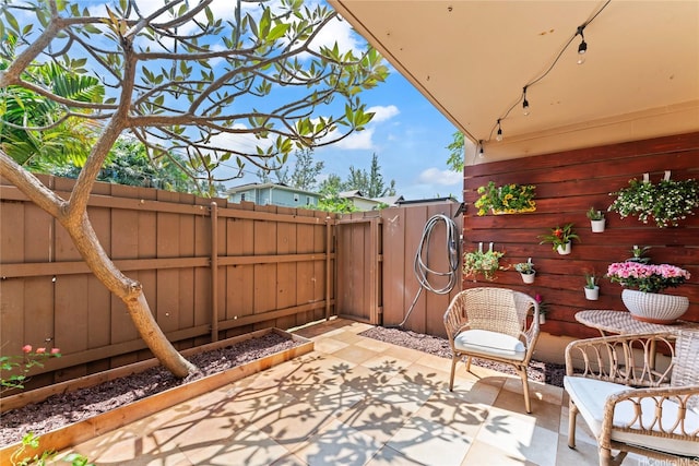 68-090 Au St Unit E102, Waialua, HI 96791 - view of patio / terrace featuring fence and a gate
