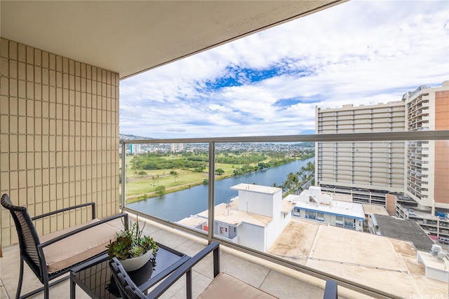 balcony featuring a water view