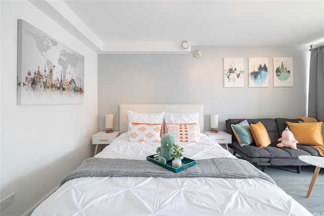 bedroom featuring wood finished floors